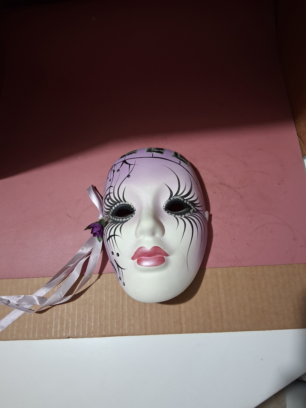 Decorative White and Pink Venetian-Style Face Mask with Ribbon Accent